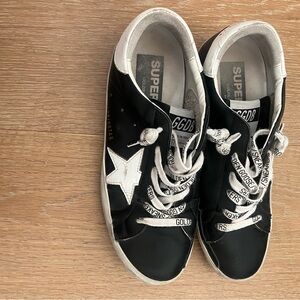 Black golden goose low sneakers